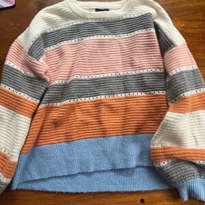 Lumíere sweater size medium.